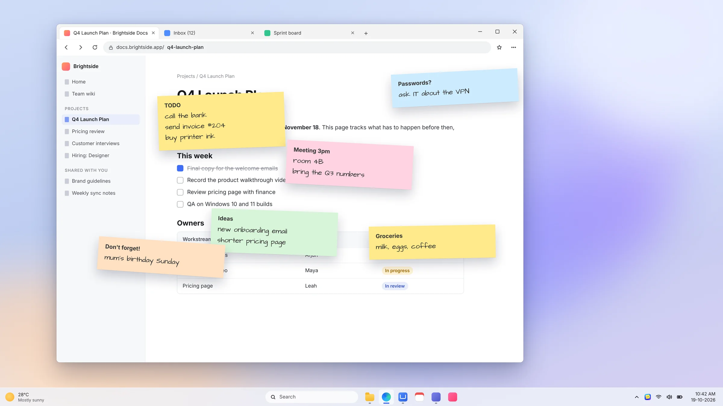 A desktop covered with scattered sticky notes on top of a document